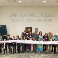 Friends and family cut the dedication ribbon.